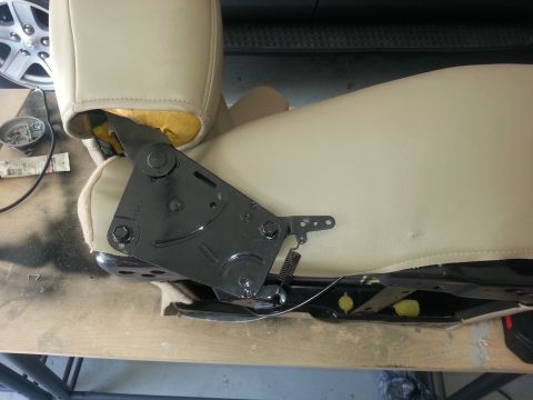 1994 Ford Bronco - Detail of a vehicle seat's internal adjustment mechanism, with visible springs and metal components.