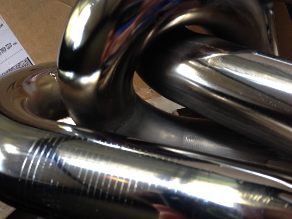 These are images that I sent in of the defects for my return. I have chosen to document them here for future use.

Update: I have sent these back in favor of the ceramic ones as I could not accept installing a part that was not fully coated and rusting right out of the box.
