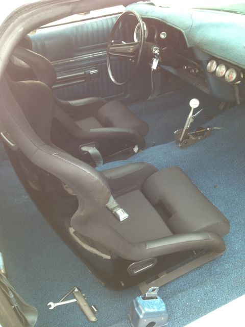 1972 Ford Ranchero - Interior view of a 1972 Ford Ranchero, racing seats and a floor shifter.