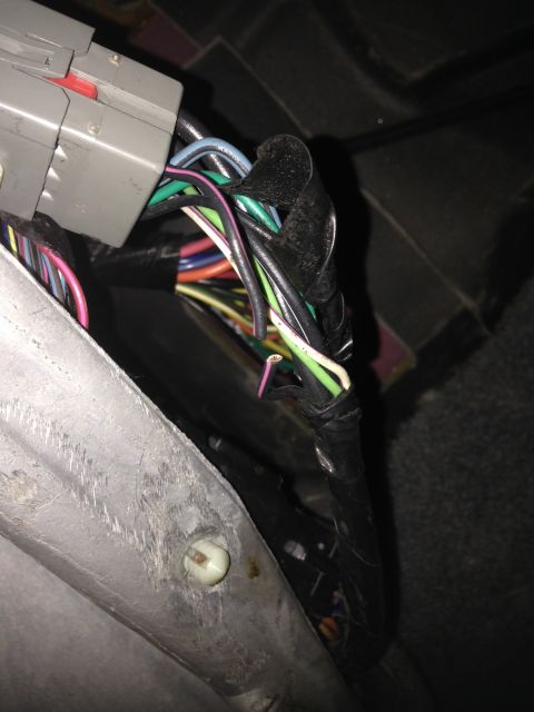 1995 Ford Bronco - This harness with the cut wire is on the driver's side, next to the E-brake. The wire in question is purple and black.