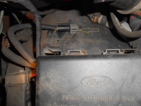 1992 Ford Bronco - Close-up of Ford power distribution box and electrical connectors under the hood.