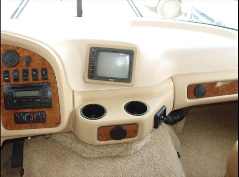 2010 Ford F-450 - The interior of an RV shows the dashboard with various controls and a central screen.