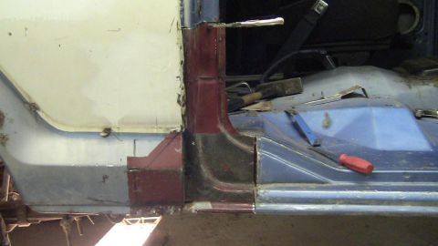 1979 Ford Bronco - Interior view of a vehicle undergoing body panel repair, with visible rust and tools.