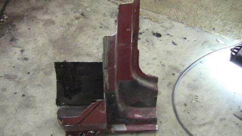 1979 Ford Bronco - This appears to be a section of a car's body panel, possibly a rocker panel or fender, showing significant rust and damage.