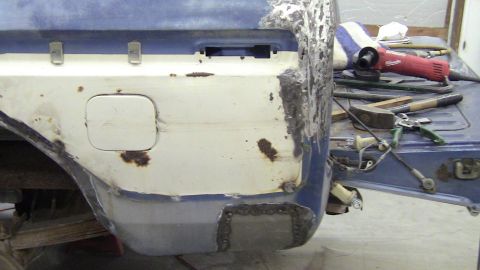 1979 Ford Bronco - Repairing the rear quarter panel of a 1978 Ford Bronco, showing rust damage and new welds.
