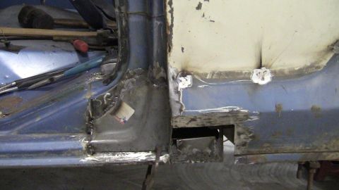 1979 Ford Bronco - Metal fabrication and welding are underway on the interior of a vehicle's body panel.