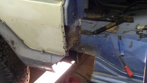 1979 Ford Bronco - Rust repair in progress on a 1979 Ford Bronco's body panel.