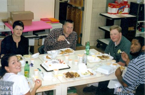 1995 Ford Bronco - A group of people are gathered around a table, enjoying a meal together.