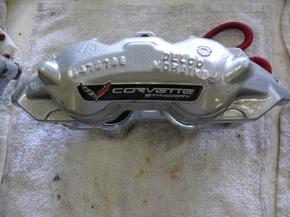 Silver Corvette Stingray brake caliper with "DELCO MORAINE" and part number 0470736
