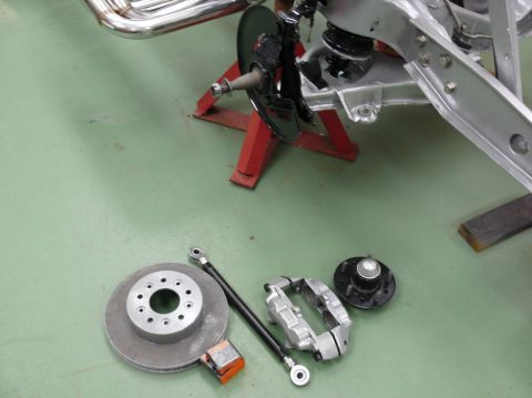 Corvette C3 brake rotor, caliper, and hub assembly laid out
