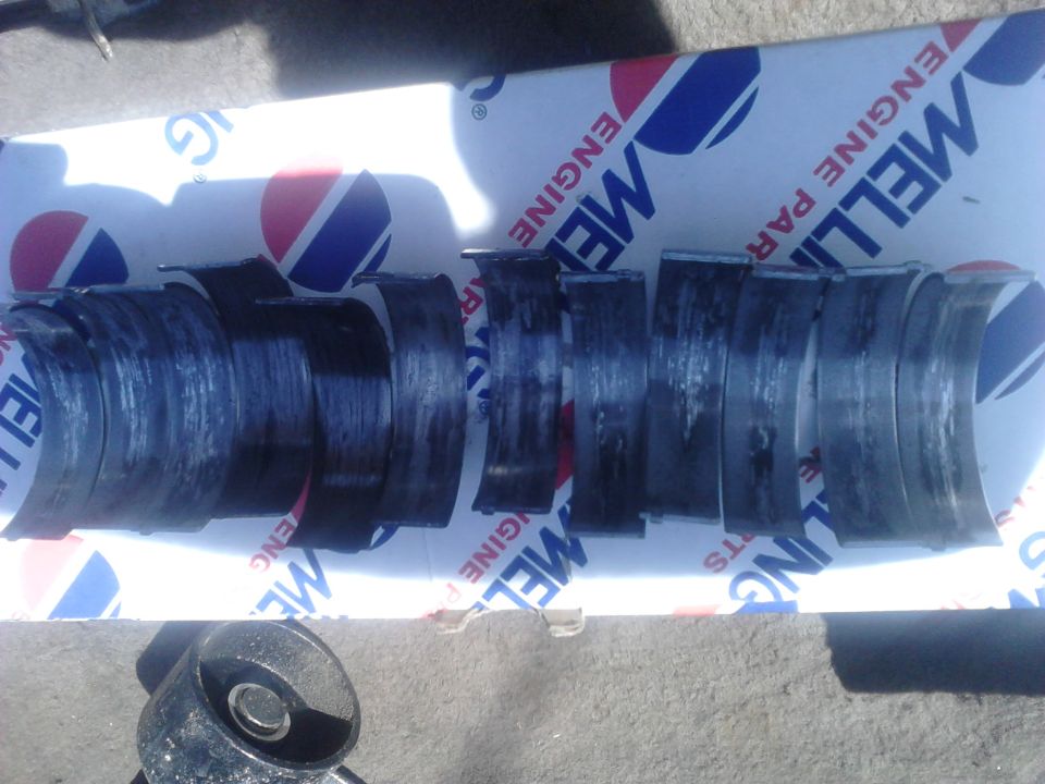 DAY 3:

pulled the tranny and transfer case. tranny needs a rebuild as the clutches burned up and it wont shift into 3rd. will probably sell as a core. transfer case I sold

I started disassembling the seized engine to figure out what caused it to go bad. took the intake and heads off and found nothing wrong there. took the pan off and it became very clean a bearing was the cause as there was metal flakes everywhere. unbolting all the main caps showed extreme wear with deep grooves, to ill present, and bearings in horrible shape. Taking the rod caps off showed the same but the #2 and #6 rod bearings (which are together on the crank) were obviously the cause. the bearings were actually missing and the caps were banged up bad enough that I had to cut them off to disconnect them.

this was a remanufactured crankshaft and came with matching 10/10 bearings, I used a lot of assembly lube, primed the oil pump, and checked clearances. don\\'t know why the bearing originally had a problem. im assuming that the bearing must have spun, seized on the crank but the engine didn\\'t seize the engine. it spun until it flaked apart and the cleacence became soo much that all the oil pressure was going to it instead of the others. the others without oil pressure would then eventually lock up till it seized the engine.

good news is that the engine is still useable. I have the original crank which is in pristine condition (no grooves at all). everything is good to reuse but it will need 2 new connecting rods, new bearings, oil pump, pickup screen, gaskets. also I plan on using it instead of the 302 from my old truck so I have more power.