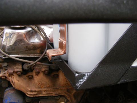 Engine bay detail with oil filter and custom bracket