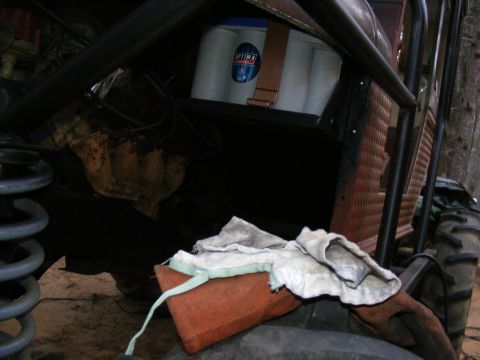 Off-road vehicle interior showing an Optima battery secured with a strap