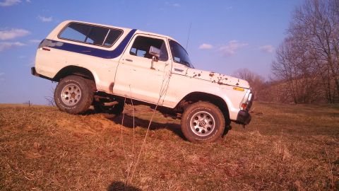 1979 Ford Bronco - This 1978 Ford Bronco is shown off-road on a sunny day with a clear blue sky.