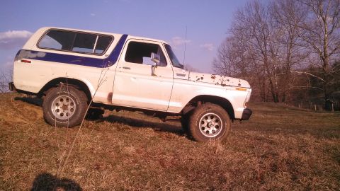 1979 Ford Bronco - This 1978 Ford Bronco is parked on a grassy hill under a clear blue sky.