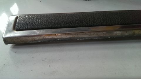 1975 Ford Ranchero - Close-up of a vehicle trim piece, possibly from an interior door panel.