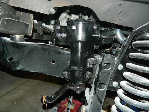 1979 Ford Bronco - Close-up view of a vehicle's steering gearbox and suspension components, with a watermark from Supermotors.net visible.