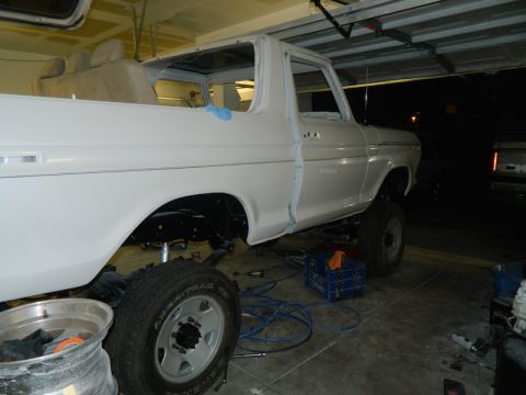 1979 Ford Bronco - This 1979 Ford Bronco is in a garage, appearing to be in the process of restoration with its doors removed.