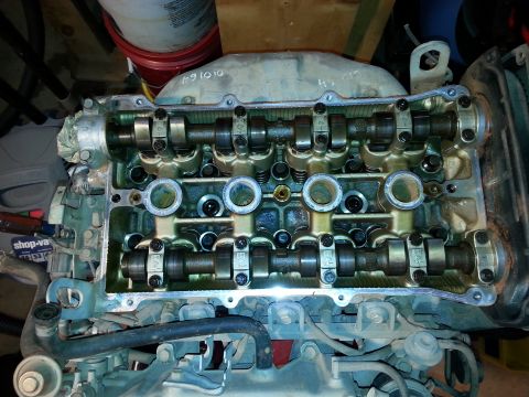 1991 Ford Festiva - Close-up view of an engine's valve cover, revealing the camshafts and associated components.