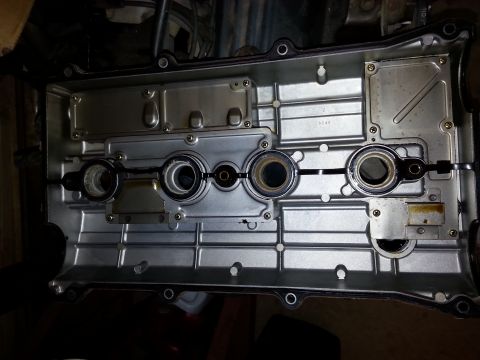 1991 Ford Festiva - Close-up of an engine's valve cover, showing internal components.
