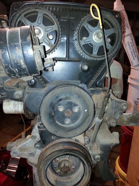 1991 Ford Festiva - Close-up view of an engine's timing belt and associated pulleys.