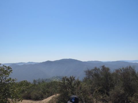 1989 Ford Bronco - A wide view of rolling hills and mountains on a clear day.