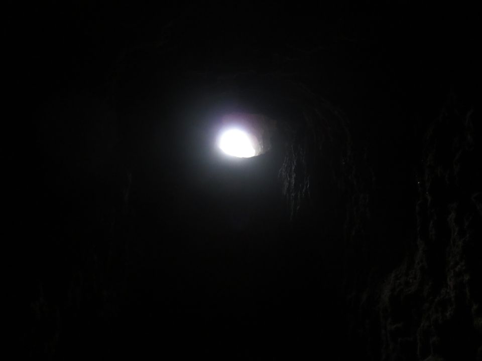light shining through a dark cave opening