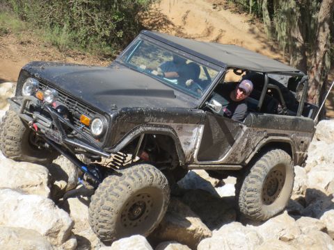 1989 Ford Bronco - This modified 1969 Ford Bronco navigates a challenging rocky terrain.