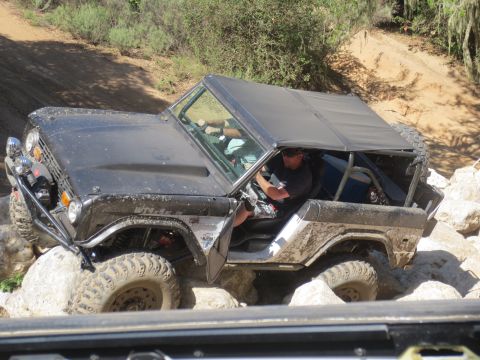 1989 Ford Bronco - Ford Bronco tackling a challenging rocky off-road course.