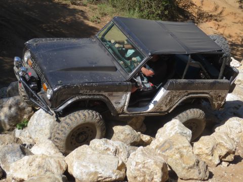 1989 Ford Bronco - This classic Ford Bronco navigates a challenging rocky terrain, its off-road capabilities.