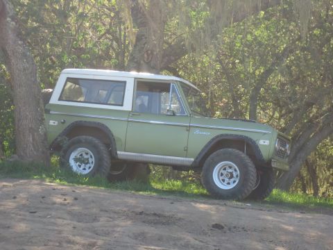 1989 Ford Bronco - This classic Ford Bronco, likely from the 1970s, is seen parked off-road.
