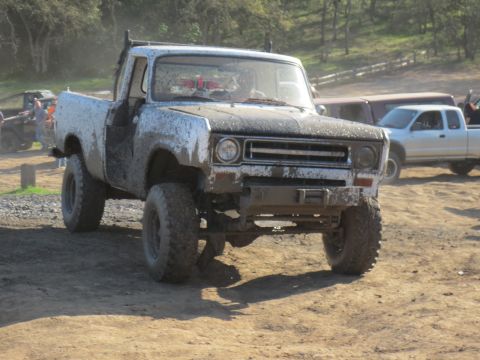 1989 Ford Bronco - This mud-splattered pickup truck appears to be an International Harvester model from the 1970s.