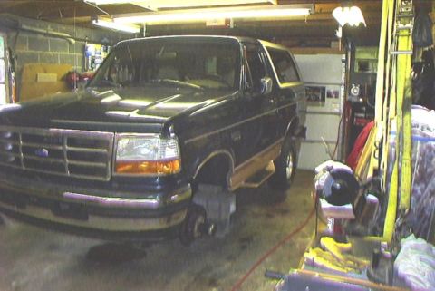 1995 Ford Bronco - Bronco on blocks for lift kit installation