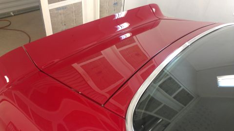 1972 Pontiac Trans Am - Close-up of the rear decklid and window trim on a red 1972 Pontiac Trans Am.