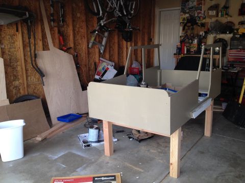 2005 Jeep Wrangler - This appears to be a partially constructed vehicle body, possibly a replica or custom build, resting on sawhorses in a garage setting.