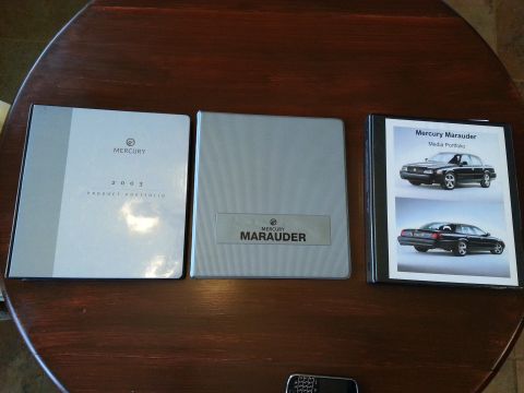 2003 Mercury Marauder - A collection of Mercury Marauder promotional materials, including a 2003 product portfolio and media kit.