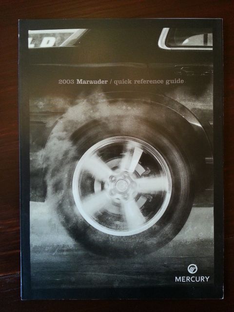 2003 Mercury Marauder - This is a promotional document for the 2003 Mercury Marauder, a dynamic image of a spinning wheel.