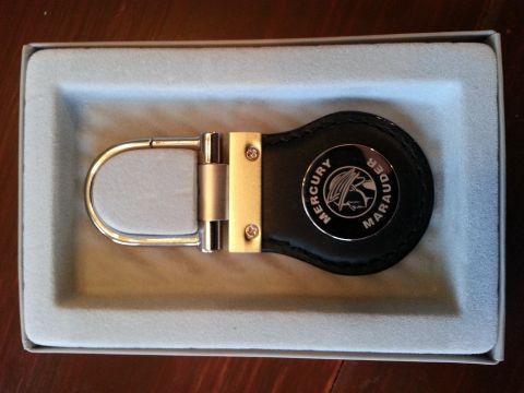 2003 Mercury Marauder - A Mercury Marauder keychain is presented in a light blue foam insert within a box.