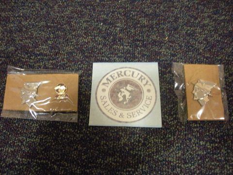 2003 Mercury Marauder - Promotional items for Mercury Sales & Service, including a circular sticker and two pins.