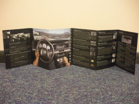 2003 Mercury Marauder - This promotional brochure displays the interior of a 2003 Mercury Marauder, including the dashboard and steering wheel.