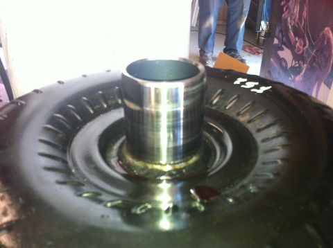 1982 Ford Bronco - A close-up view of a vehicle's torque converter, showing its internal components and some markings.
