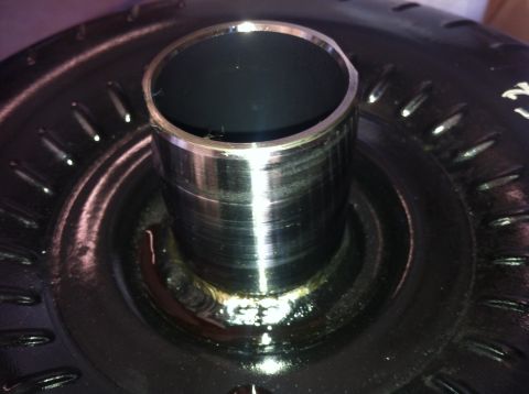 1982 Ford Bronco - A close-up view of a torque converter, a component of an automatic transmission system.