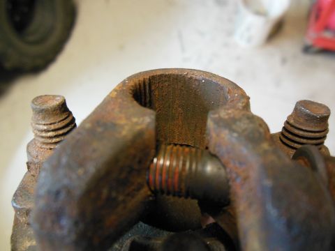 1979 Ford Ranchero - Rusted U-joint assembly with a bolt being threaded through.