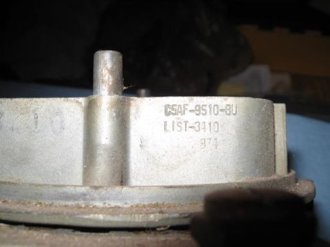 1963 Ford Galaxie - Close-up of a metal automotive part with stamped identification numbers.