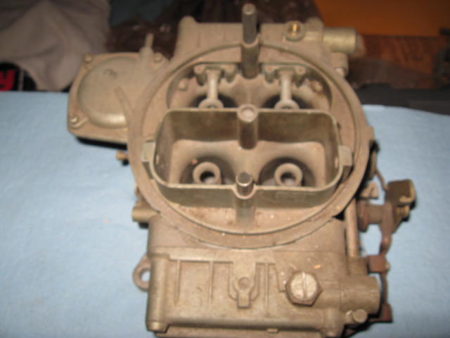 Carburetor with visible text 'SUPERMOTORS'