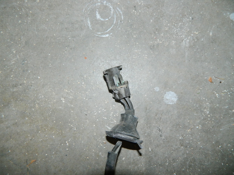 Electrical connector and wiring harness on concrete floor