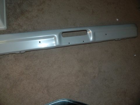 1979 Ford Bronco - A gray front bumper is shown, likely a replacement part for a vehicle.