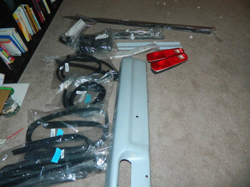 1979 Ford Bronco parts including taillights and trim pieces