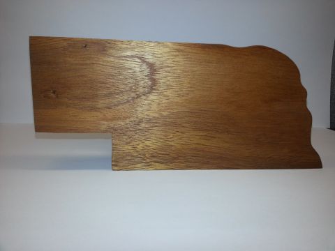 2010 Champion 188 - A wooden plaque with a unique shape is displayed against a white background, with a Supermotors logo in the corner.