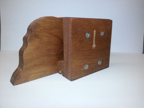 2010 Champion 188 - A wooden component with a decorative curved edge is shown, fastened with screws.